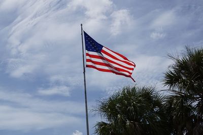 Low angle view of flag against sky