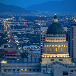 High angle view of illuminated buildings in city at dusk