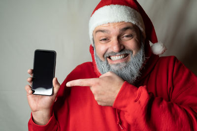 Portrait of mid adult man using mobile phone