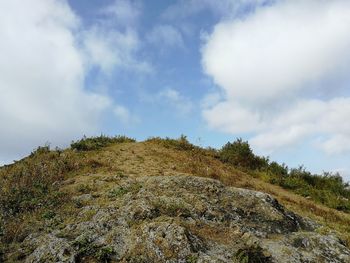 Low angle view of rocks against sky