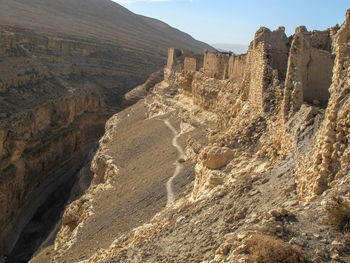 Aerial view of landscape with mountain range in background