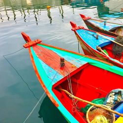 Boats moored in water