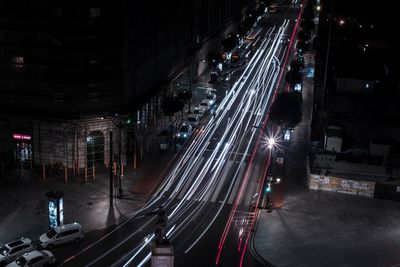 High angle view of light trails on road at night