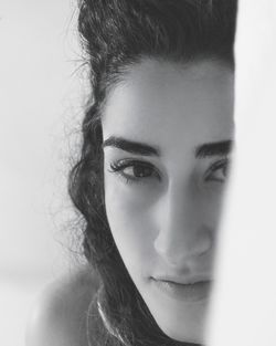 Close-up portrait of beautiful woman at home