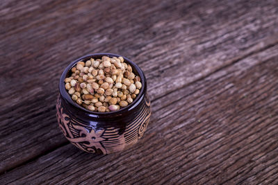 High angle view of bread in container on wooden table