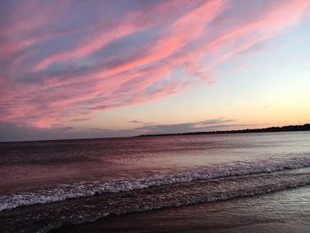 Scenic view of beach against sky during sunset