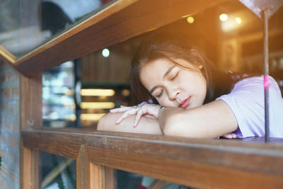 Portrait of cute girl sitting on seat