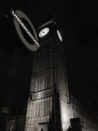 Low angle view of tower at night