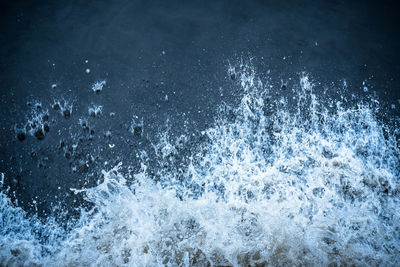 Close-up of water splashing in sea