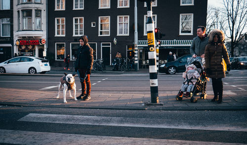 Full length of woman walking on city street