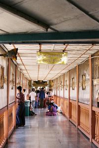 People sitting in corridor of building