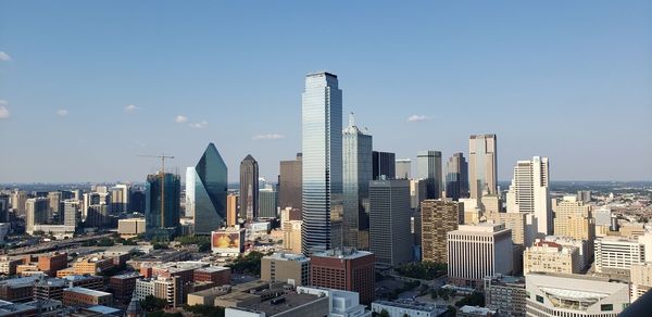 Modern buildings in city against sky