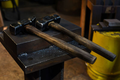 Close-up of hammer on wood