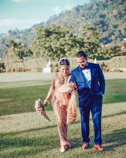 Full length of couple standing outdoors