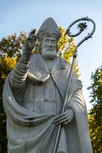 Low angle view of statue against sky