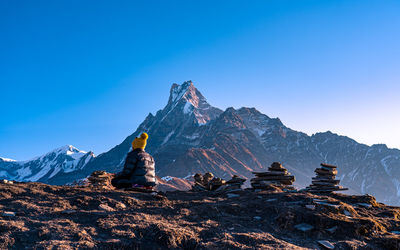 Scenic view of mountains against clear blue sky