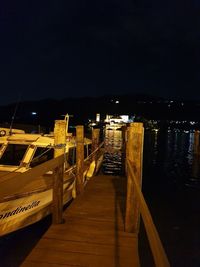 Empty pier against sky at night