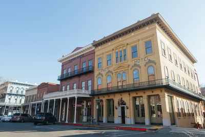 Street by building against clear sky