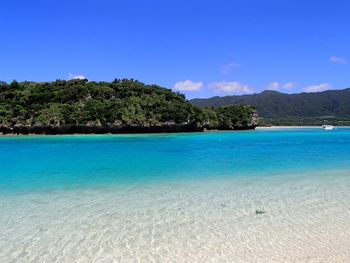 Scenic view of sea against clear blue sky