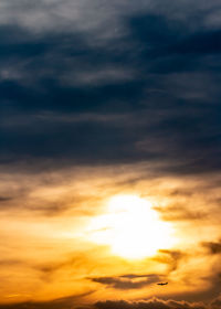Low angle view of dramatic sky during sunset