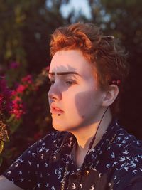 Portrait of young woman looking away