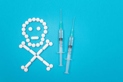 Directly above shot of blue container over white background