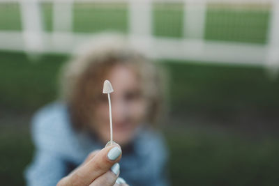 Woman showing mushroom