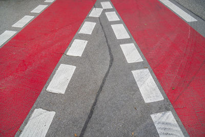 Cycle path with red marking on the road