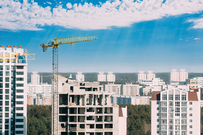 Buildings in city against sky