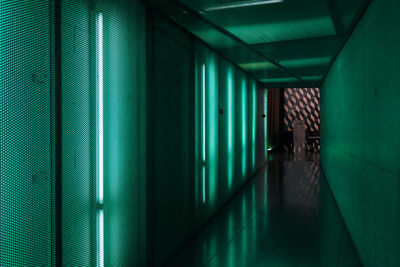 Man walking in illuminated building