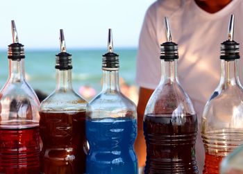 Close-up of wine bottles on table