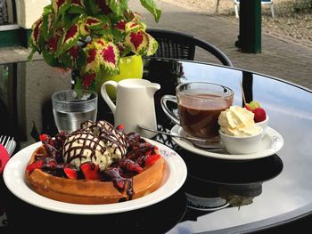 Close-up of dessert with coffee served on table