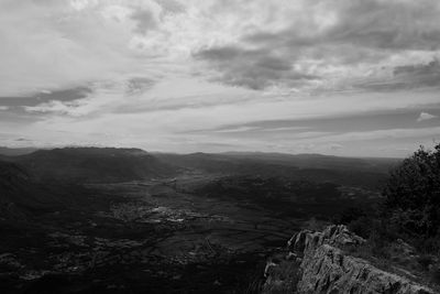 High angle view of mountain against cloudy sky