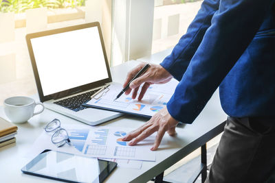 Low section of person working on table