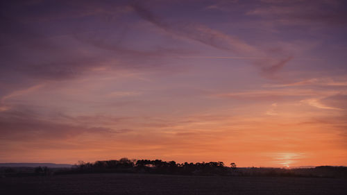 Scenic view of silhouette landscape against sky during sunset