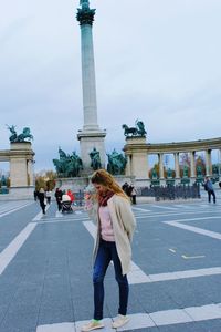 People walking in front of historical building