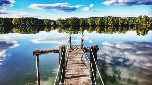 Scenic view of calm lake against sky
