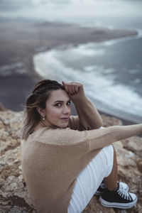 Portrait of young woman in water