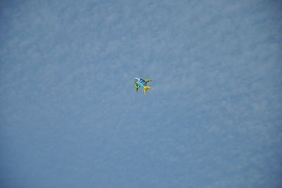 Low angle view of balloons flying in sky