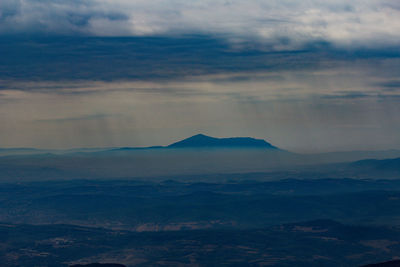 Scenic view of mountains against sky during sunset