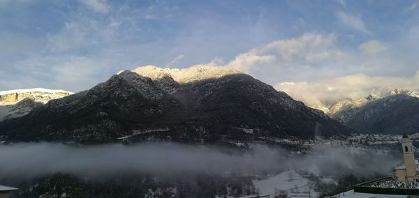 Scenic view of mountains against sky during winter