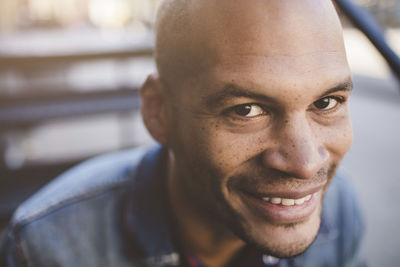 Portrait of mid adult man smiling outdoors