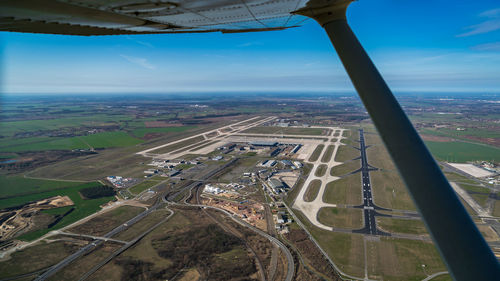 Aerial view of airport seen through airplane window