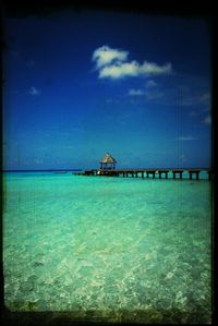 Scenic view of sea against cloudy sky