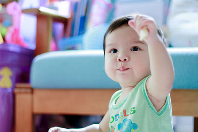 Portrait of cute baby girl looking away