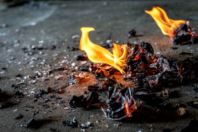 Picture of a fire burning paper on the ground