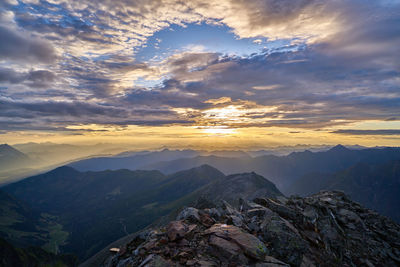 Aerial view of mountains against sky during sunset