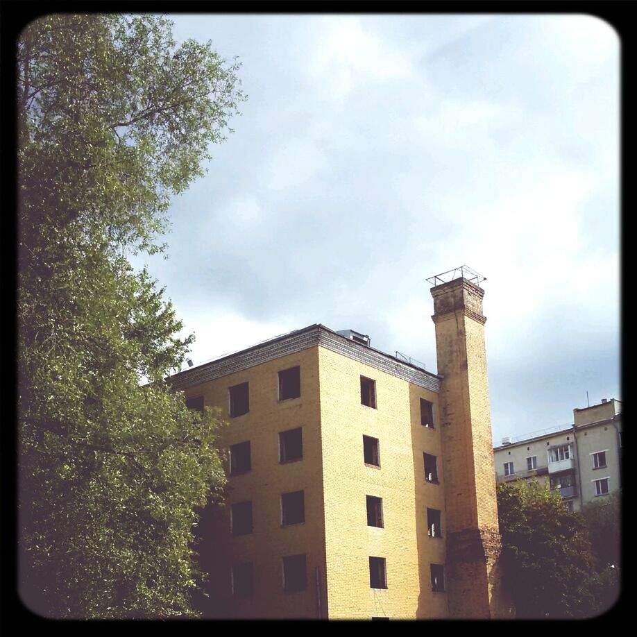 architecture, building exterior, built structure, transfer print, sky, low angle view, auto post production filter, tree, cloud - sky, window, cloud, residential structure, building, residential building, cloudy, house, city, day, outdoors, no people