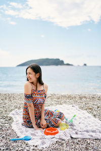 Woman sitting on beach