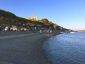 View of built structures against clear sky